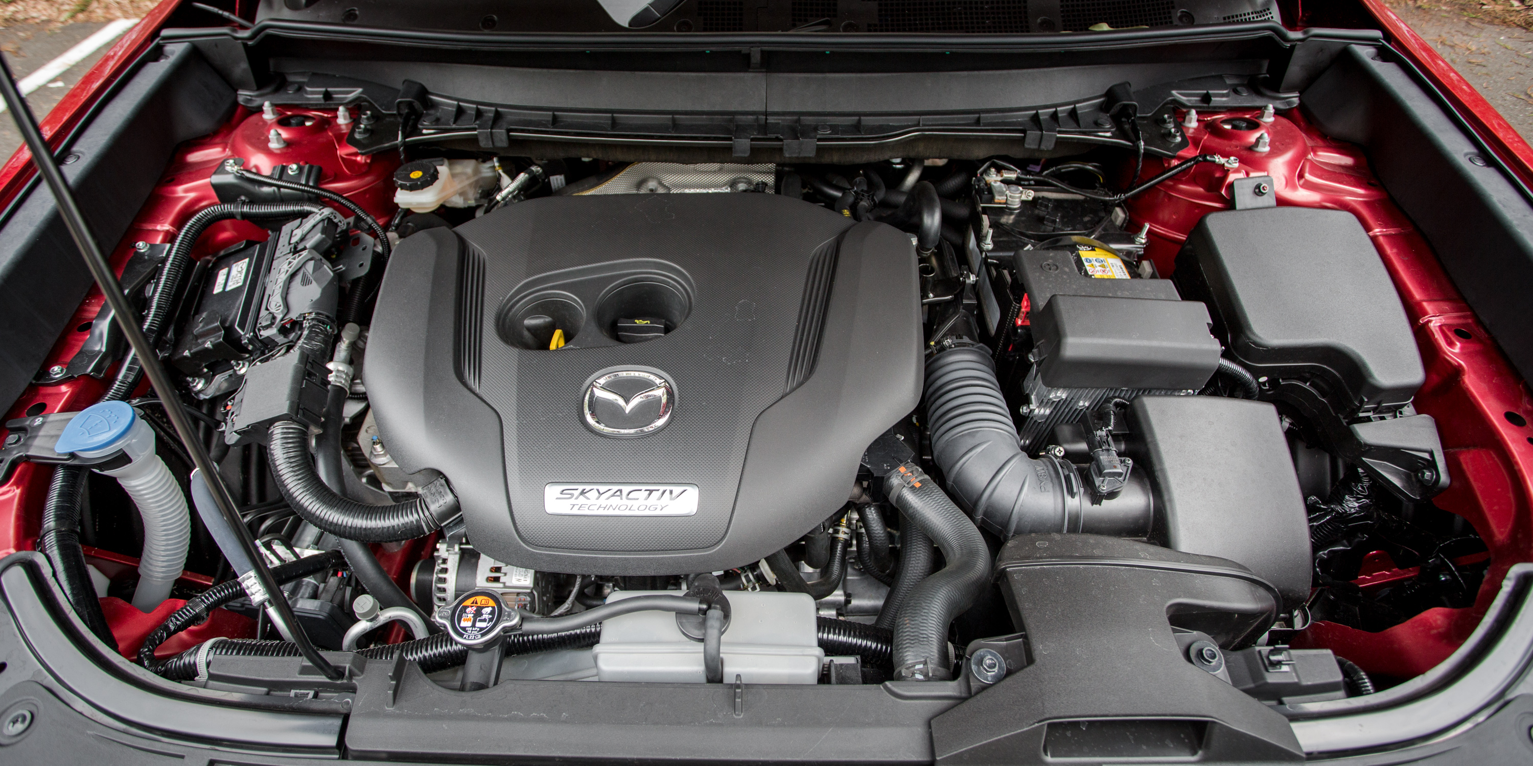 Мазда сх5 двигатель 2. Mazda CX 5 двигатель. Двигатель Мазда cx5. Моторный отсек Мазда сх5. Мазда CX 9 двигатель.